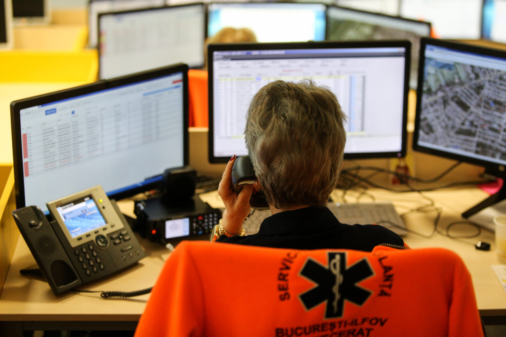First responder taking calls at their desk